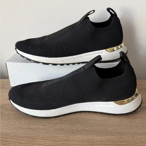 Michael Kors Black Knit Slip-On Sneakers with White Soles and Gold Heel Trim